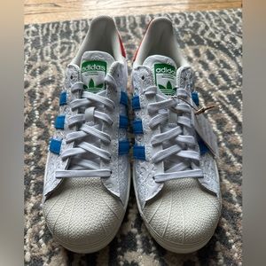 Men's Superstar shell toe sneakers.